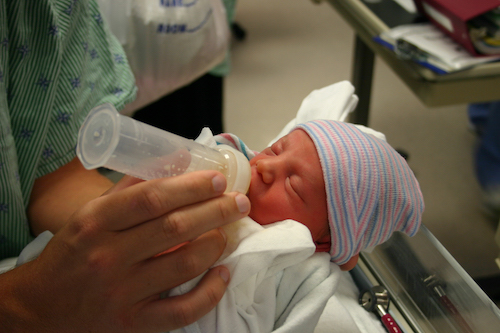 Milk Bank Services newborn being fed milk from a bottle